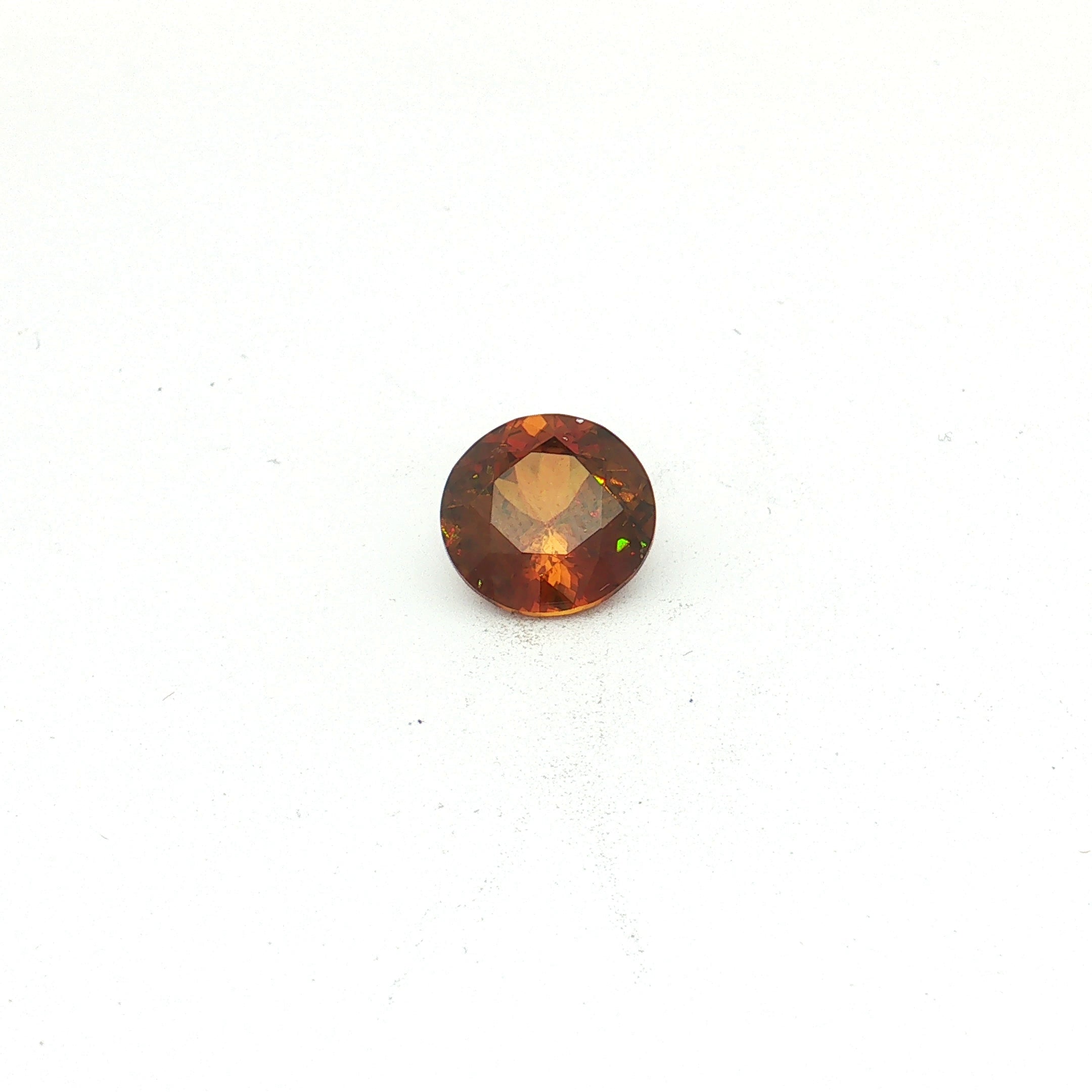 Brownish Yellow Sphene, 4.89 ct, Round · Brilliant